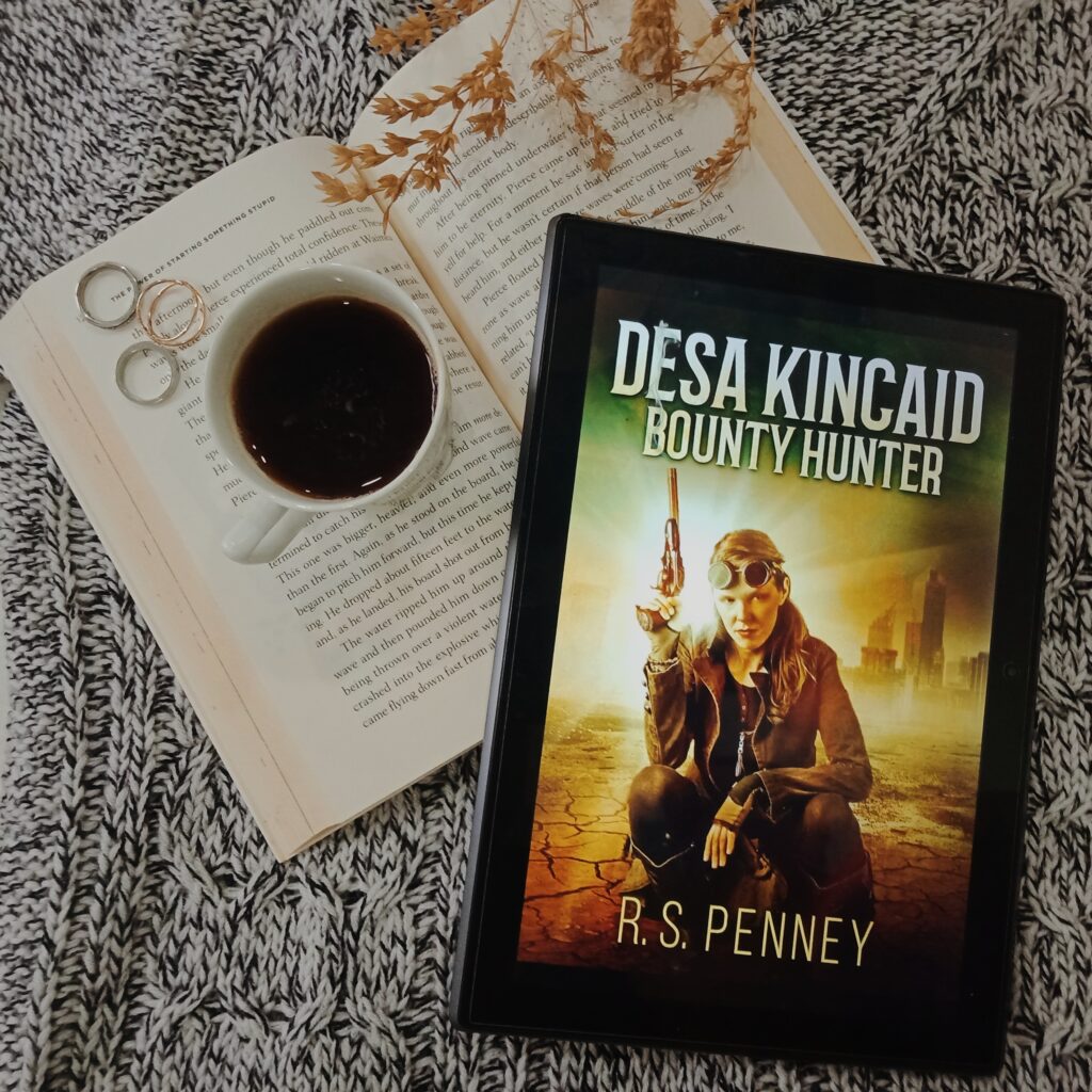 Bounty Hunter, first part of series Desa Kincaid written by R.S. Penney is kept with a coffee and rings