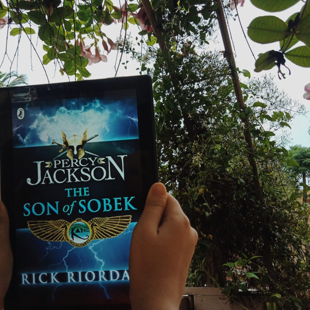 The Son of Sobek by Percy Jackson. The book is pictured with greenery around it.